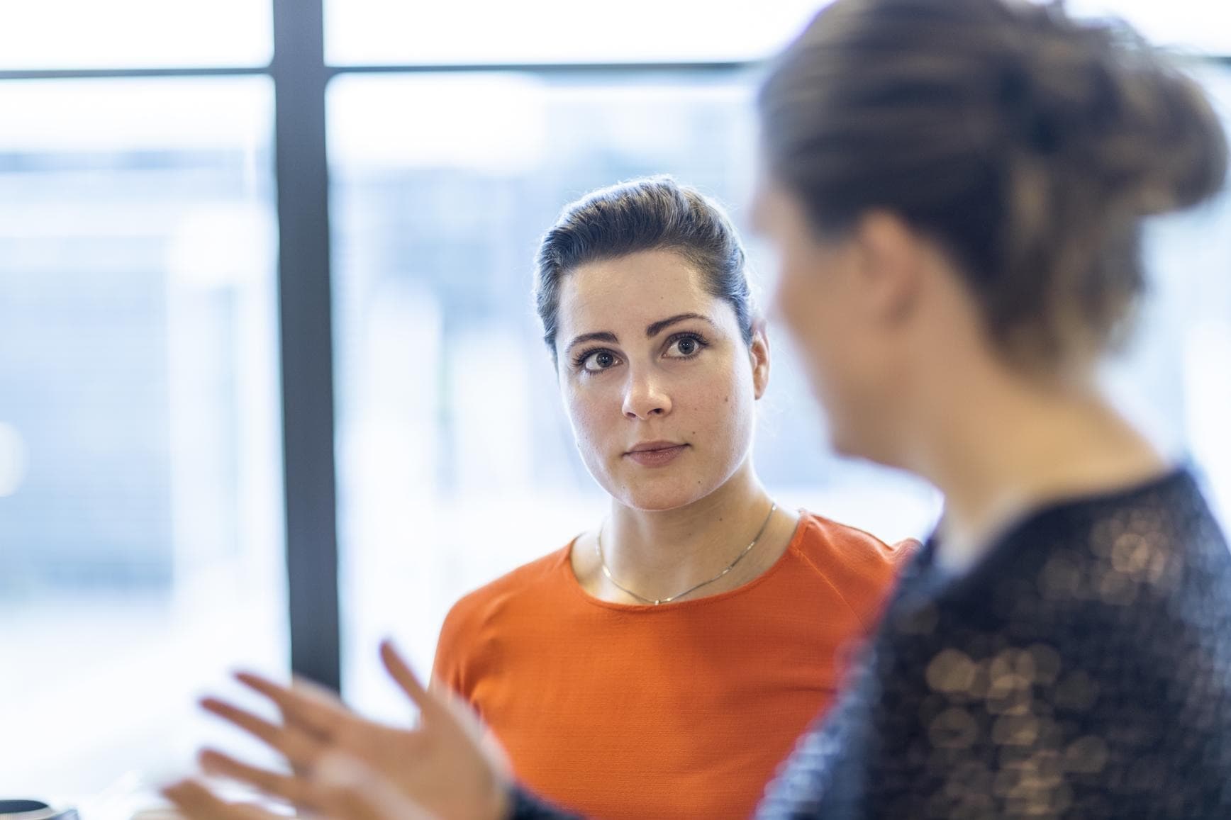 Two DFDS employees discussing ideas at the DFDS headquarters in Copenhagen