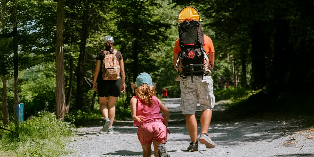 Family enjoying a hike in the sunshine