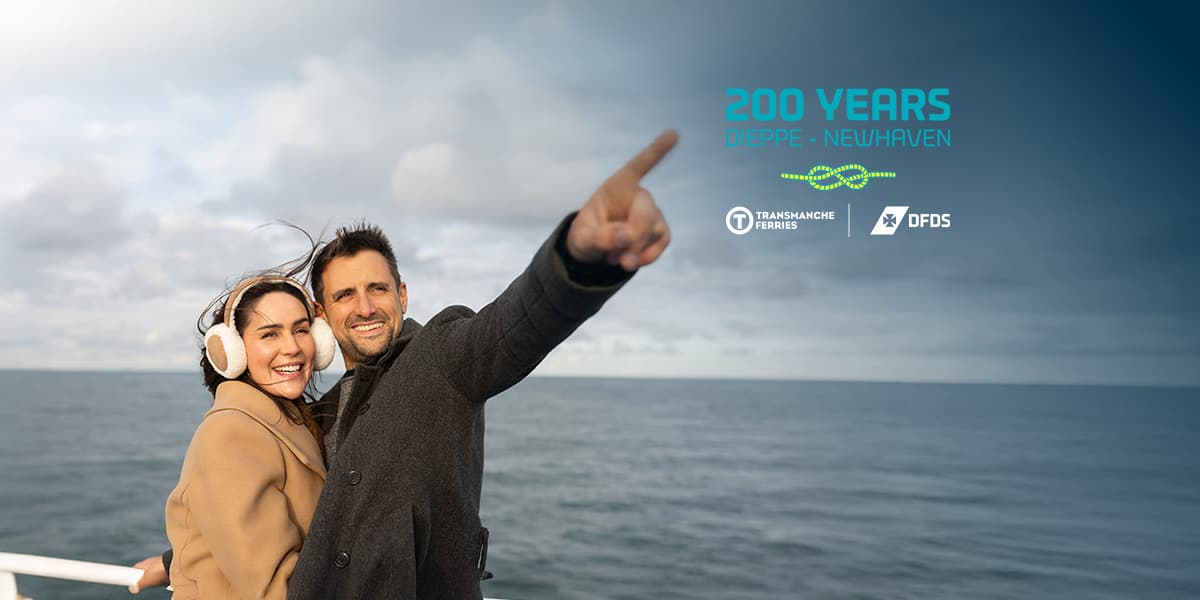 Couple on deck of DFDS ferry at sunset