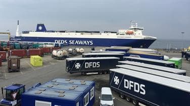 DFDS Jutlandia Seaways at shipping terminal with DFDS trailers