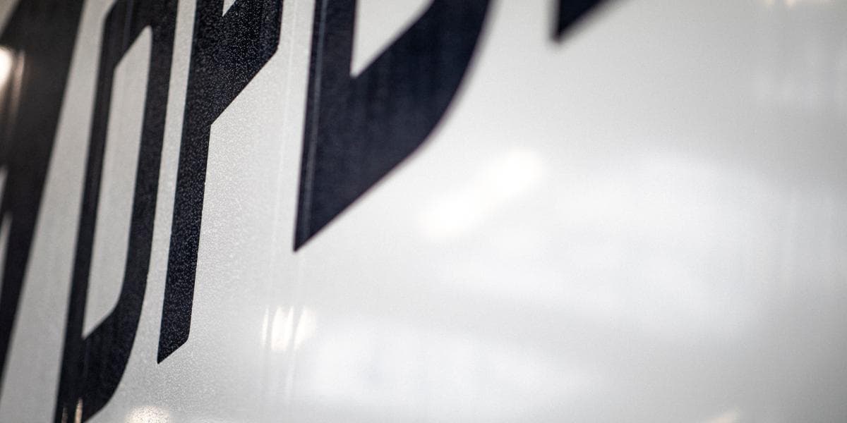 DFDS logo seen on a white background, at an angle from beneath, not completely in the view
