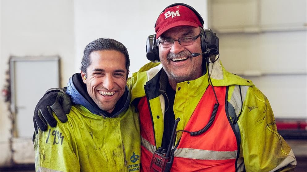 DFDS employees smiling inside a DFDS terminal
