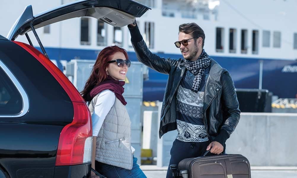Couple packing their car for holiday on DFDS ferry