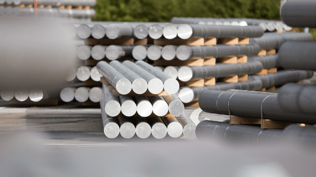 Stacks of metal tubes from the metal industry.