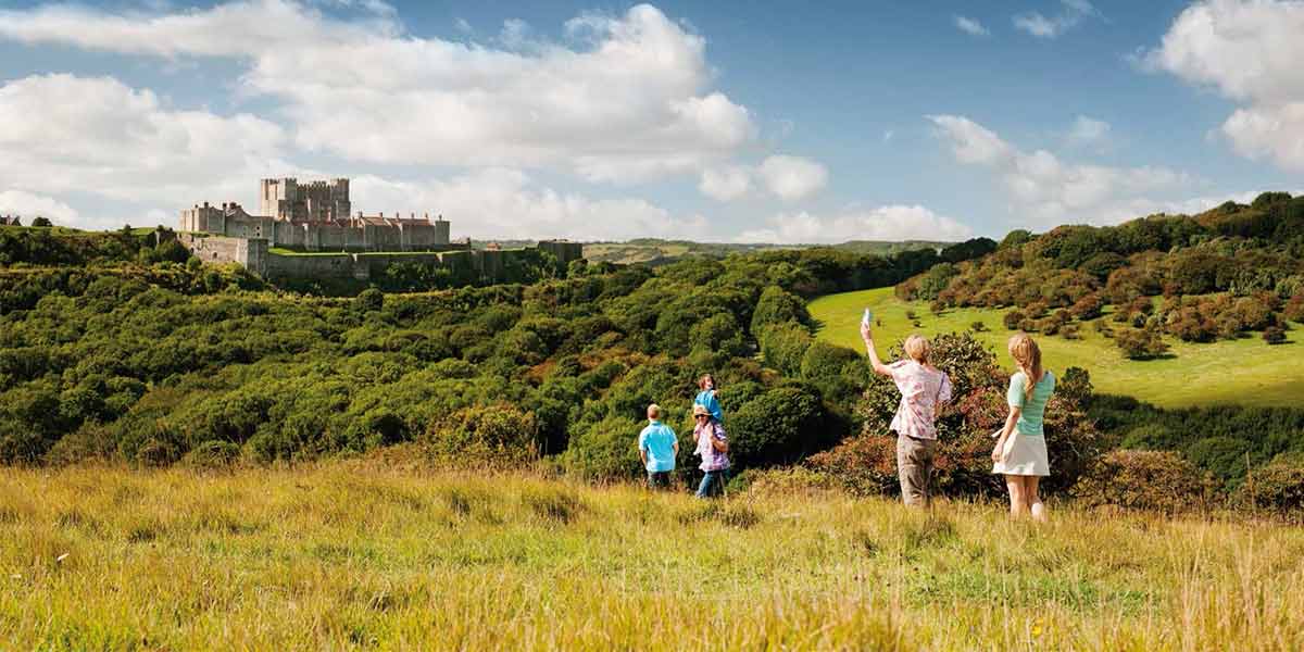 Dover castle in the distance on a sunny day
