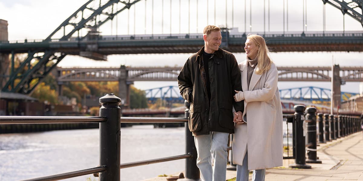 A couple walking in Newcastle.